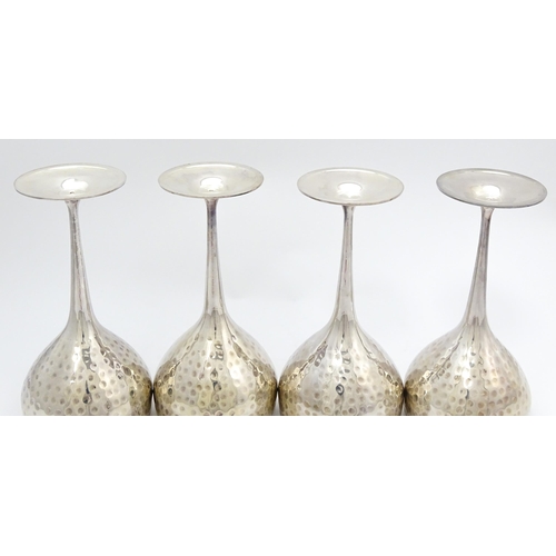 717 - Four late 20th / early 21stC silver plate goblets with hammered decoration. Approx. 8