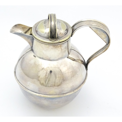 718 - A silver plate Channel Island cream jug, marked under C. T. Maine, maker Jersey. Approx. 6 1/2