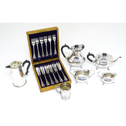 721 - A quantity of silver plated wares to include tea set, fish knives and forks, Christening mug etc.