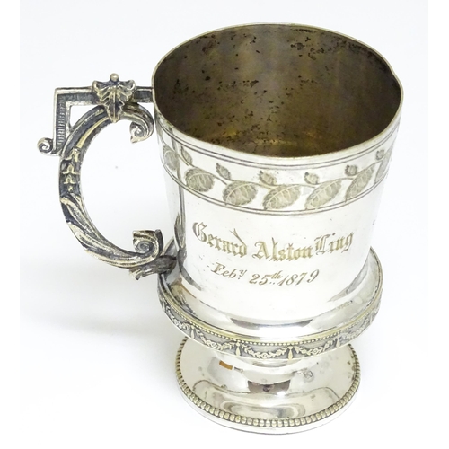 721 - A quantity of silver plated wares to include tea set, fish knives and forks, Christening mug etc.