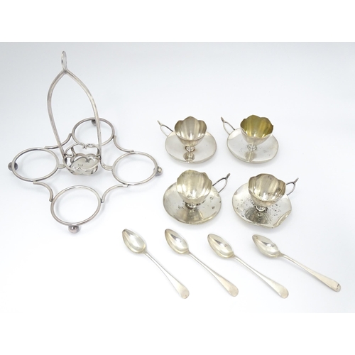 724 - Three assorted silver plate egg cruets, to include one with twin egg cups and toast rack section, an... 