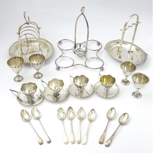 724 - Three assorted silver plate egg cruets, to include one with twin egg cups and toast rack section, an... 