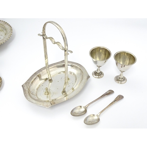 724 - Three assorted silver plate egg cruets, to include one with twin egg cups and toast rack section, an... 