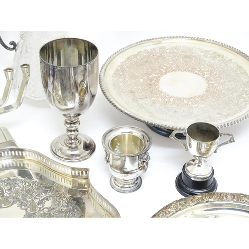 726 - A quantity of assorted silver plated wares to include a claret jug with silver plate mounts by Hukin... 