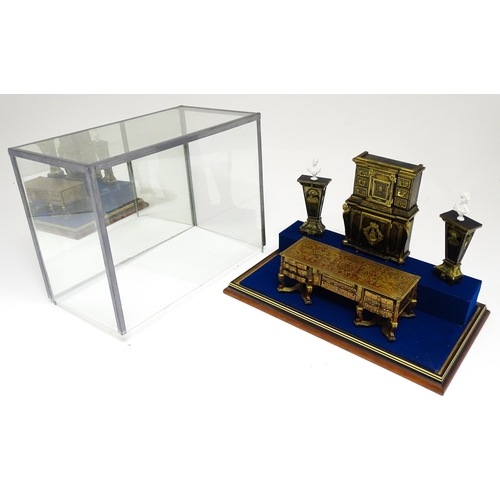 1499 - A showcase containing a display of early 21stC scale model miniature models of furniture to include ... 