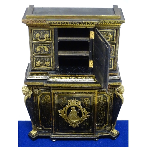 1499 - A showcase containing a display of early 21stC scale model miniature models of furniture to include ... 