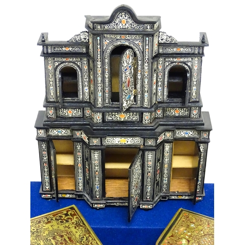 1500 - A showcase containing a display of early 21stC scale model miniature models of furniture to include ... 