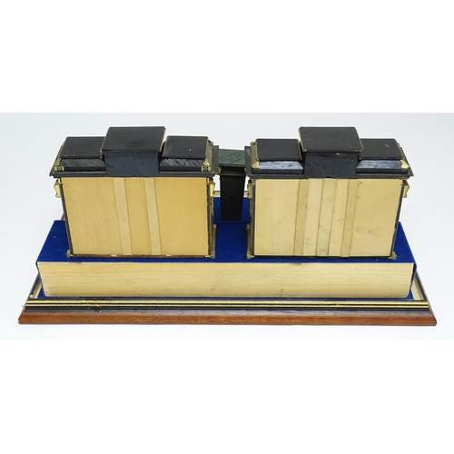 1501 - A showcase containing a display of early 21stC scale model miniature models of furniture to include ... 