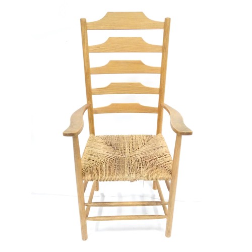 569 - A 19thC rush-seated ash ladderback chair, in stripped finish, approx 46