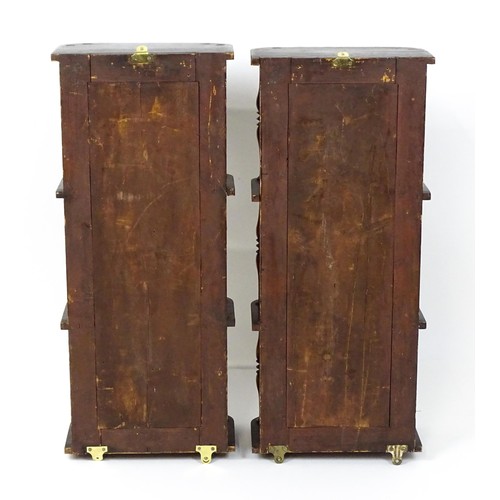 1744 - A pair of rosewood veneered mirrored wall shelves, each with four shelves supported by thin turned s... 