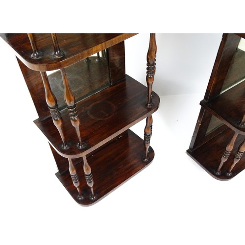 1744 - A pair of rosewood veneered mirrored wall shelves, each with four shelves supported by thin turned s... 