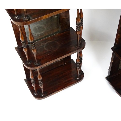 1744 - A pair of rosewood veneered mirrored wall shelves, each with four shelves supported by thin turned s... 