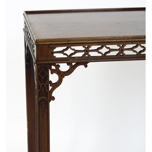 1745 - An 18thC mahogany Chinese Chippendale side table with a rectangular top above a fretwork carved frie... 