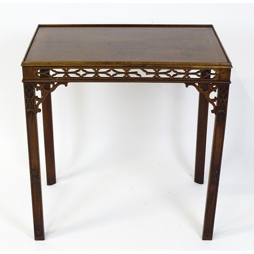 1745 - An 18thC mahogany Chinese Chippendale side table with a rectangular top above a fretwork carved frie... 