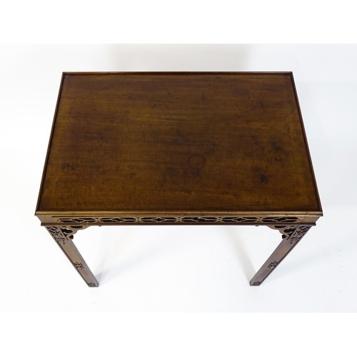 1745 - An 18thC mahogany Chinese Chippendale side table with a rectangular top above a fretwork carved frie... 