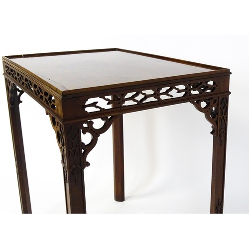 1745 - An 18thC mahogany Chinese Chippendale side table with a rectangular top above a fretwork carved frie... 