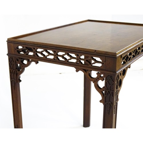 1745 - An 18thC mahogany Chinese Chippendale side table with a rectangular top above a fretwork carved frie... 