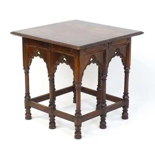 1746 - An Arts & Crafts Liberty style Moorish table with a moulded top above an apron set with eight Mooris... 