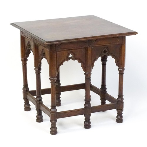 1746 - An Arts & Crafts Liberty style Moorish table with a moulded top above an apron set with eight Mooris... 