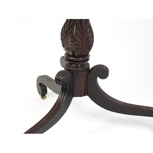 1866 - A 19thC mahogany occasional table with a turned anthemion carved pedestal base raised on three reede... 