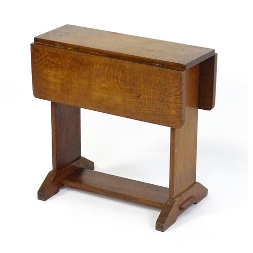 1867 - An early 20thC oak Cotswold school drop flap table. 21