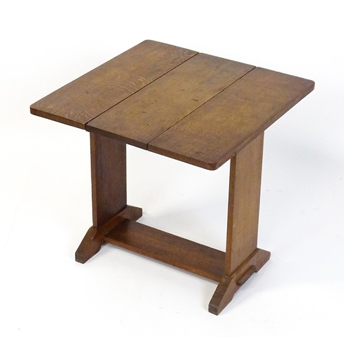 1867 - An early 20thC oak Cotswold school drop flap table. 21