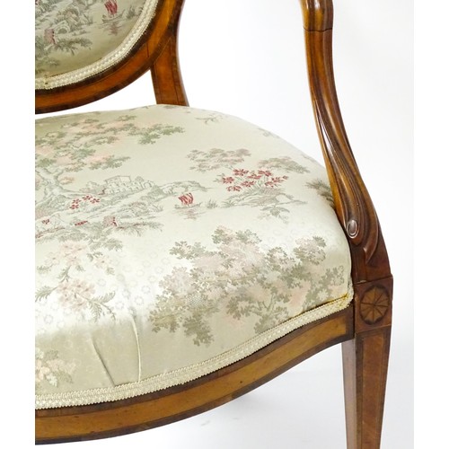 1866A - A late 18thC century Hepplewhite style satinwood library chair with an oval backrest above a sprung ... 