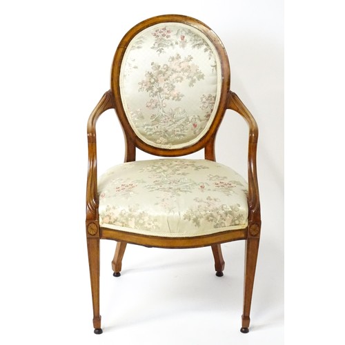 1866A - A late 18thC century Hepplewhite style satinwood library chair with an oval backrest above a sprung ... 