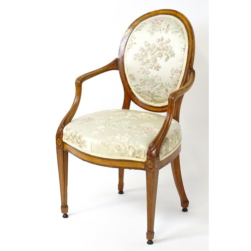 1866A - A late 18thC century Hepplewhite style satinwood library chair with an oval backrest above a sprung ... 