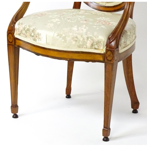 1866A - A late 18thC century Hepplewhite style satinwood library chair with an oval backrest above a sprung ... 