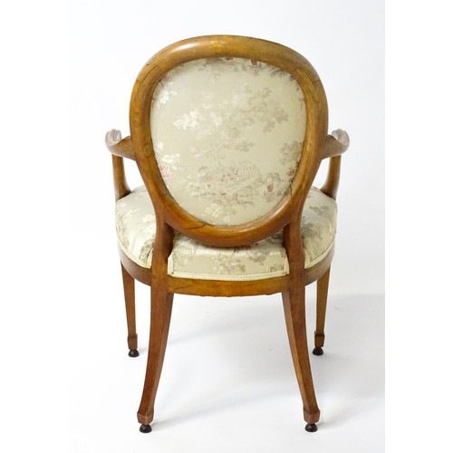 1866A - A late 18thC century Hepplewhite style satinwood library chair with an oval backrest above a sprung ... 