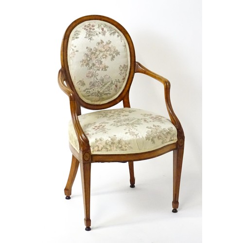 1866A - A late 18thC century Hepplewhite style satinwood library chair with an oval backrest above a sprung ... 