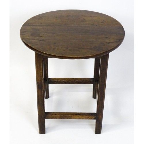 1832A - An 18thC tavern table with a circular top above a peg jointed base of four straight  chamfered legs ... 