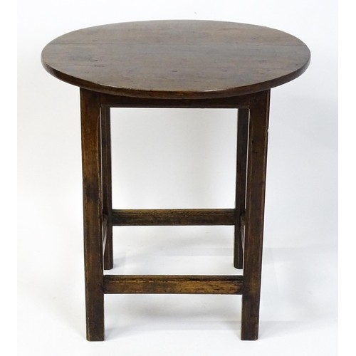 1832A - An 18thC tavern table with a circular top above a peg jointed base of four straight  chamfered legs ... 