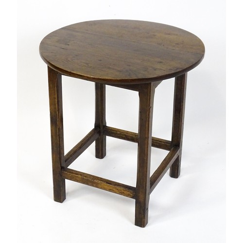 1832A - An 18thC tavern table with a circular top above a peg jointed base of four straight  chamfered legs ... 