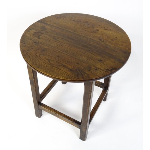 1832A - An 18thC tavern table with a circular top above a peg jointed base of four straight  chamfered legs ... 