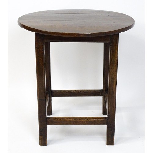 1832A - An 18thC tavern table with a circular top above a peg jointed base of four straight  chamfered legs ... 