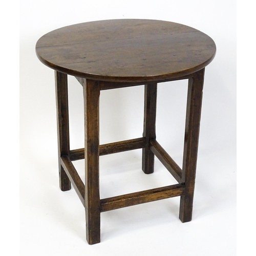 1832A - An 18thC tavern table with a circular top above a peg jointed base of four straight  chamfered legs ... 