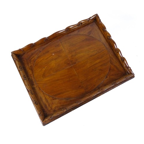 1745A - A Georgian Irish tray top table with a scrolled carved tray raised on a peg jointed base. 29