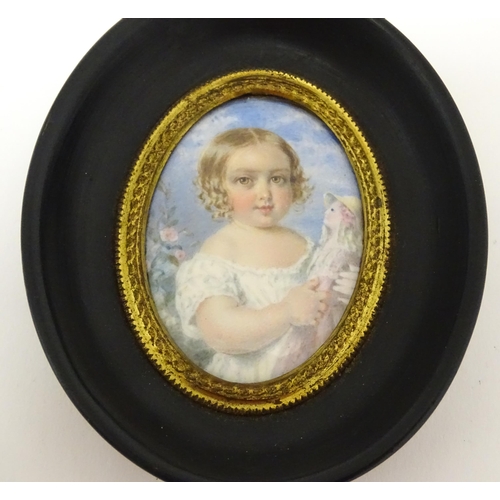 1413 - An Italian watercolour portrait miniature depicting a young girl holding a doll. In the manner of Gu... 