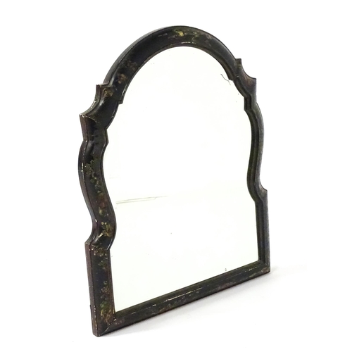 1803 - An early 20thC bevelled mirror of arched form, with carved and painted chinoiserie decoration depict... 