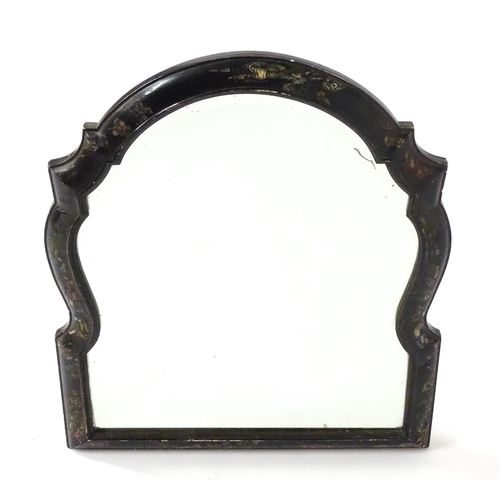 1803 - An early 20thC bevelled mirror of arched form, with carved and painted chinoiserie decoration depict... 