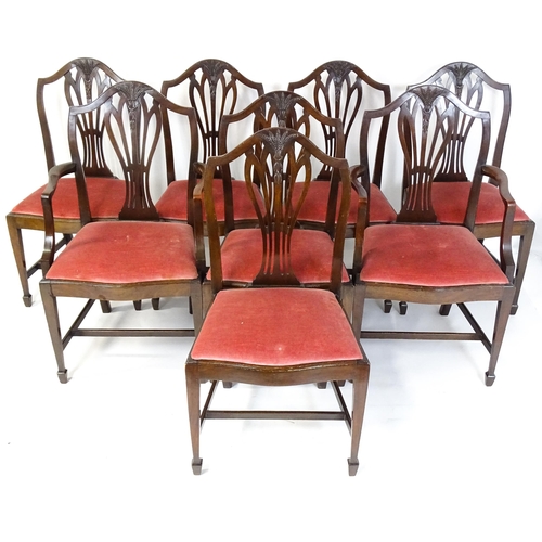 1896 - A set of eight late 19thC / early 20thC Hepplewhite style dining chairs with pierced and carved back... 