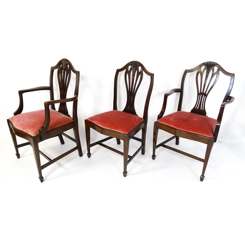 1896 - A set of eight late 19thC / early 20thC Hepplewhite style dining chairs with pierced and carved back... 