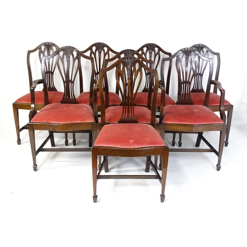 1896 - A set of eight late 19thC / early 20thC Hepplewhite style dining chairs with pierced and carved back... 