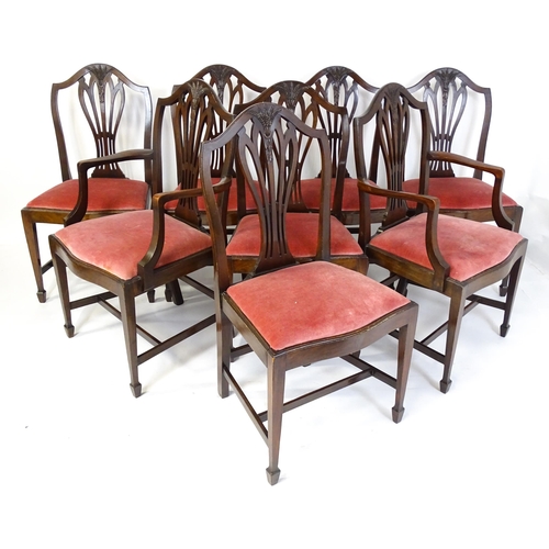 1896 - A set of eight late 19thC / early 20thC Hepplewhite style dining chairs with pierced and carved back... 