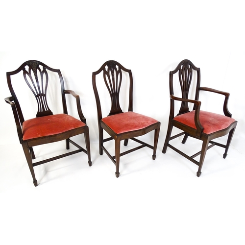 1896 - A set of eight late 19thC / early 20thC Hepplewhite style dining chairs with pierced and carved back... 