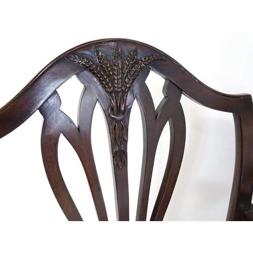 1896 - A set of eight late 19thC / early 20thC Hepplewhite style dining chairs with pierced and carved back... 