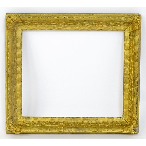 2253 - A 20thC gilt composite frame with foliate and ribbon fold detail. Rebate approx. 15