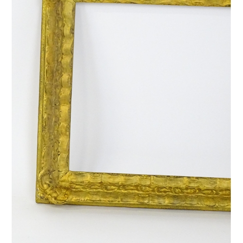 2253 - A 20thC gilt composite frame with foliate and ribbon fold detail. Rebate approx. 15